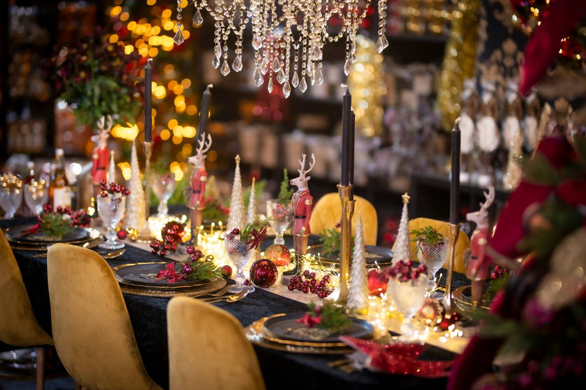 Comparison showing cluttered vs. curated Christmas figurine displays on a mantel – left side crowded with mismatched pieces, right side featuring three harmonious figurines with soft lighting
