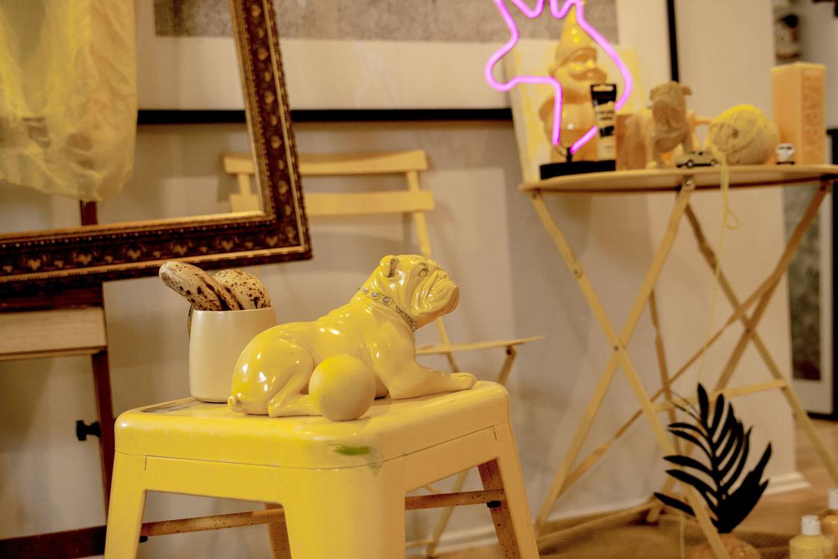 Side-by-side comparison of ceramic, resin, and porcelain highland cow figurines showing texture, weight, and paint detail differences