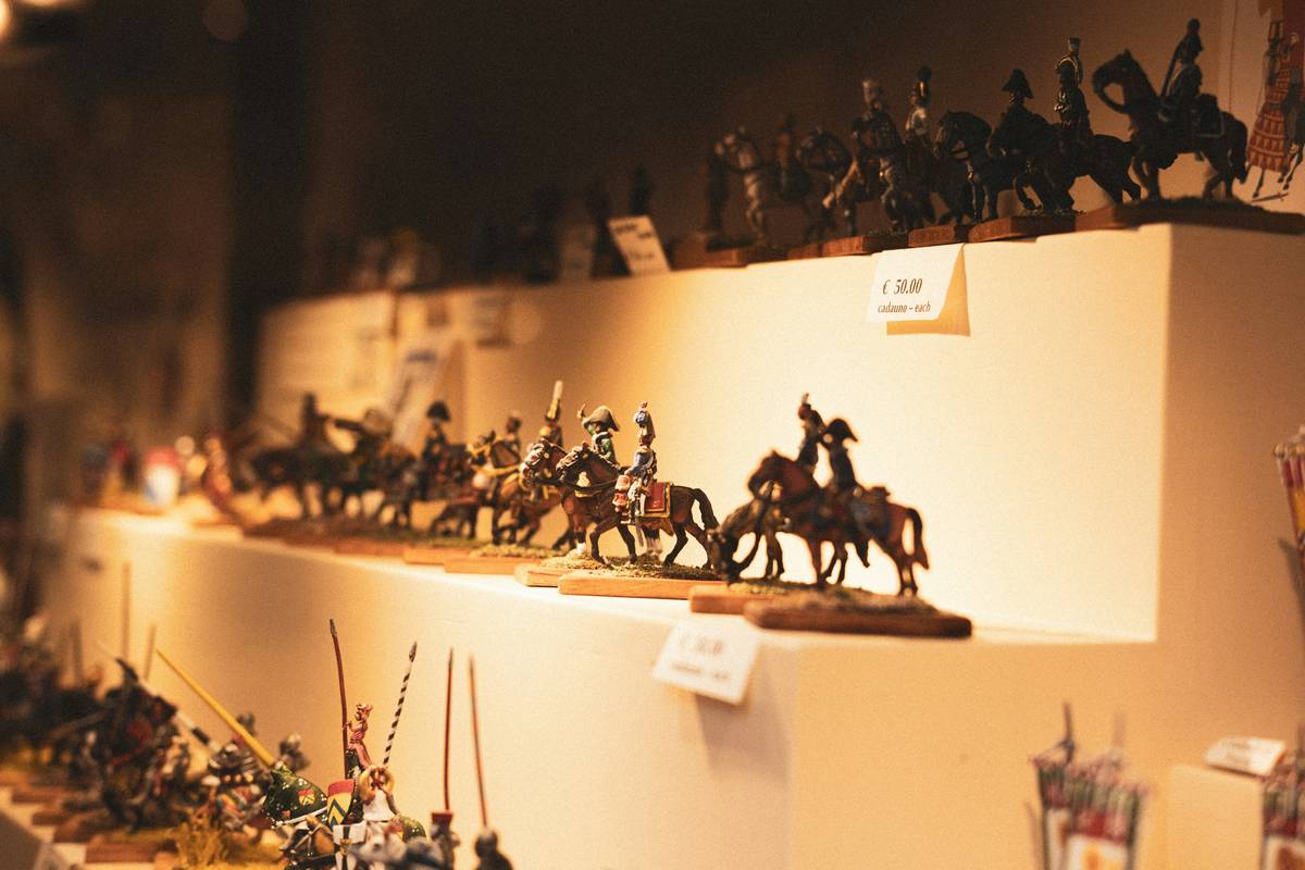 Stylish living room shelf featuring curated mini figurines home decor in brass and ceramic