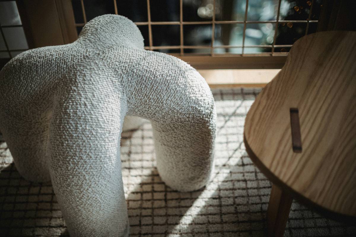 big figurines home decor displayed on a console table with neutral backdrop and ambient lighting